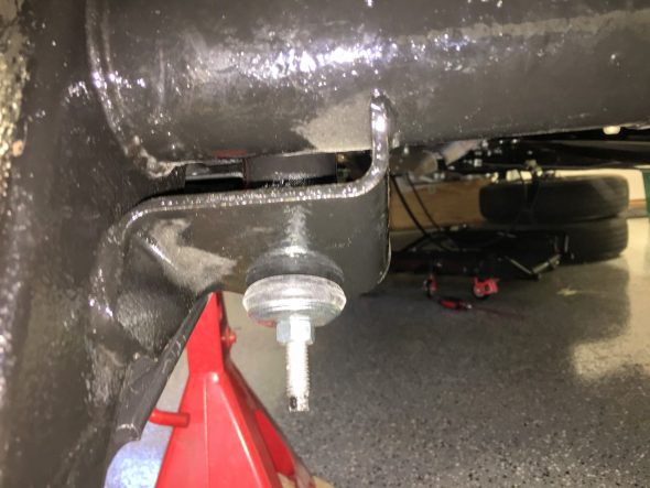Lower End of Shock Tightened with Bushing Compressed